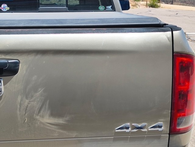 Ram 4x4 truck bed smooth and restored after paintless dent repair