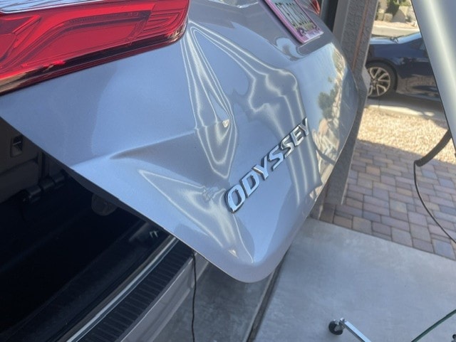 Honda Odyssey rear panel with large dent before paintless dent repair