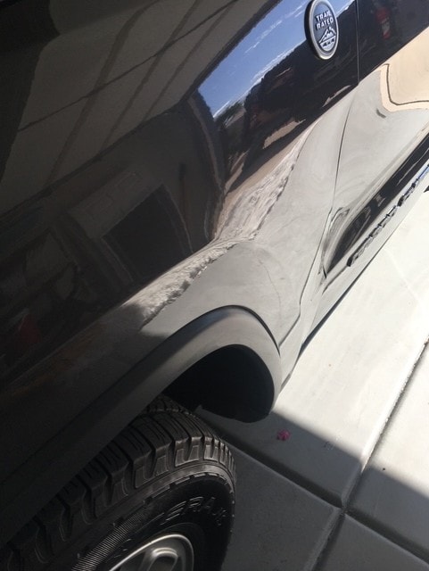 Silver SUV fender smooth and restored after paintless dent repair