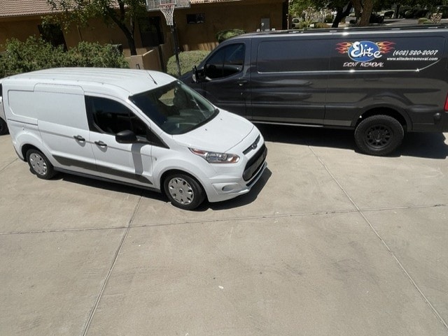 Elite Dent Removal white and dark service vans parked side by side